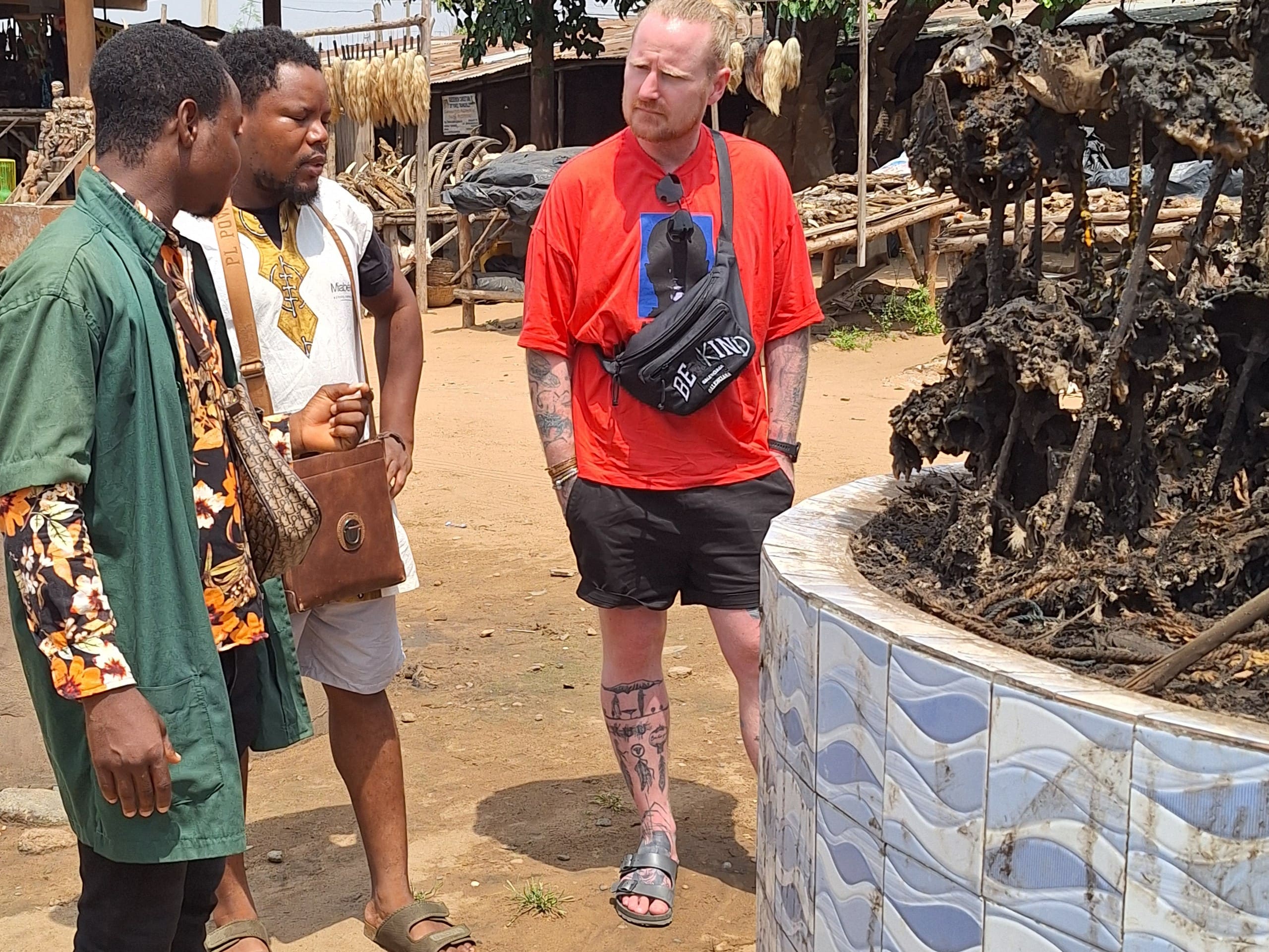 A solo traveler visiting vodoo market in Togo